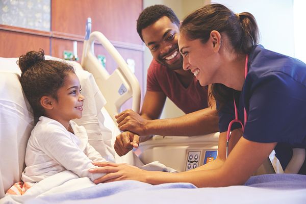 Girl in hospital bed