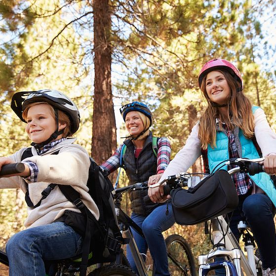 Image of a family mountain biking. 
