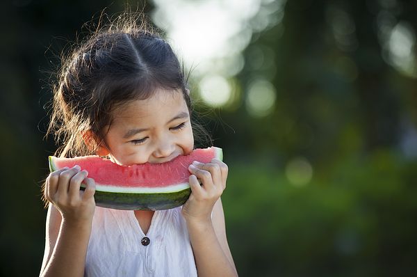 Kid eating watermelon