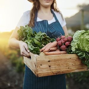 Woman carrying vegetables