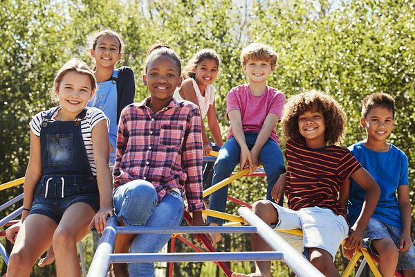 Image in Partnership for a Healthier America's 2017 Progress Report of children playing on an outdoor playground.