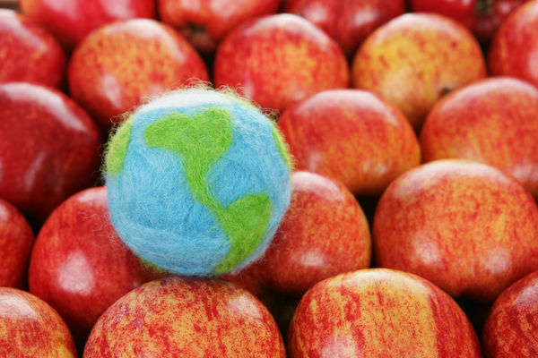 A globe with red apples