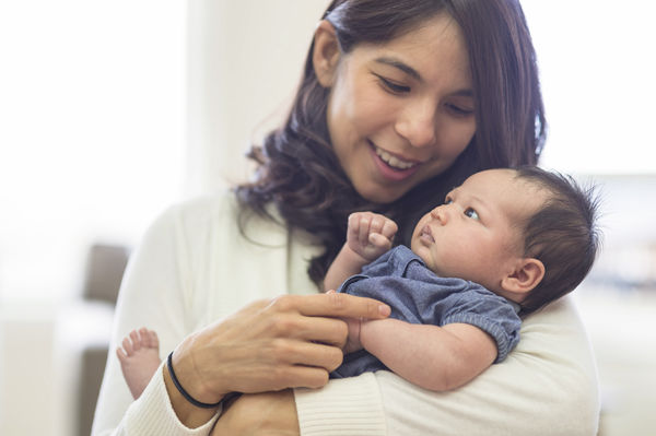 A mother holding her baby