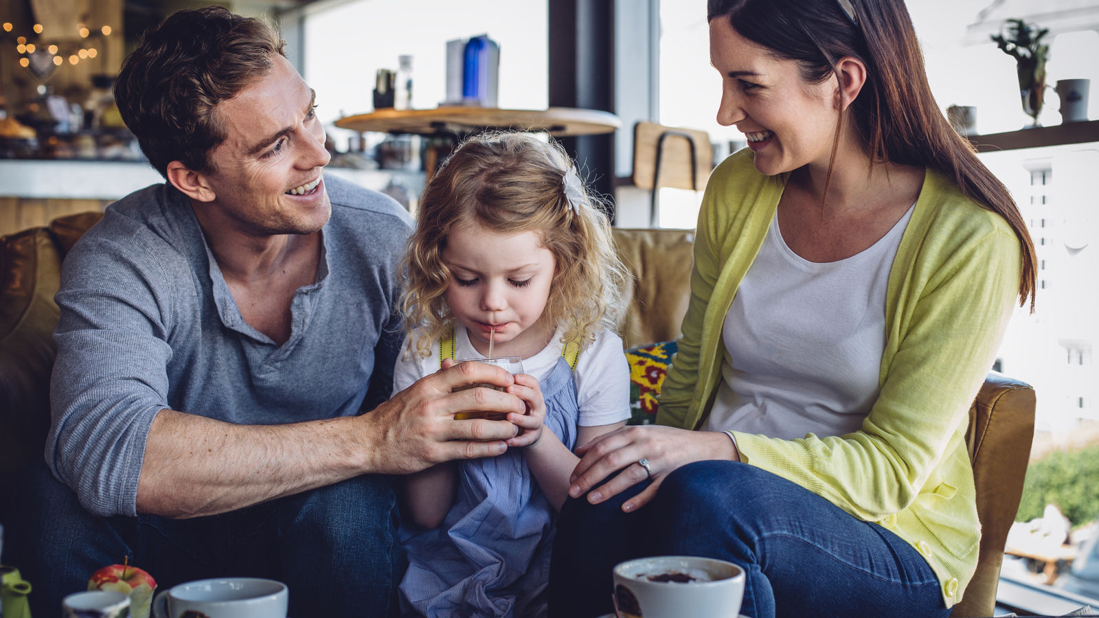 Image of a family enjoying healthier beverages in a hotel on the Partnership for a Healthier America's website.