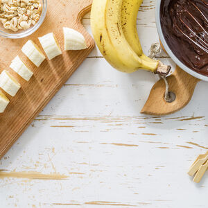 Image of bananas and chocolate for Westin's recipe for Chocolate-Covered Banana Lollipops. 