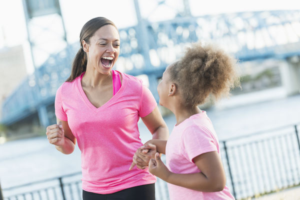 Image of a mother and daughter running together.