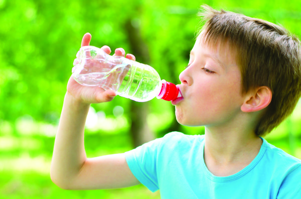 Boy drinking from water bottle