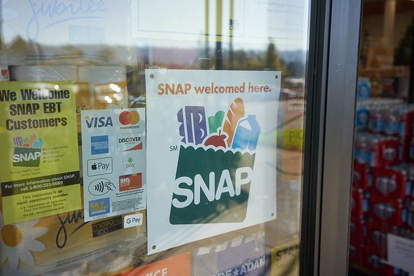 SNAP EBT Benefits Accepted Here sign in grocery store window