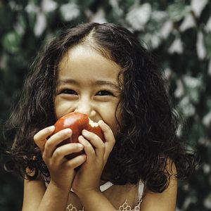 Girl eating apple