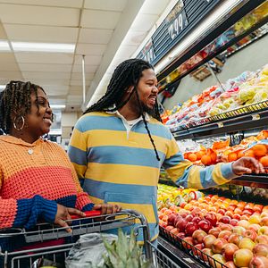 Smiling couple shops for groceries