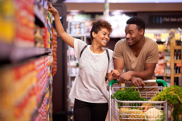 Couple grocery shopping together 