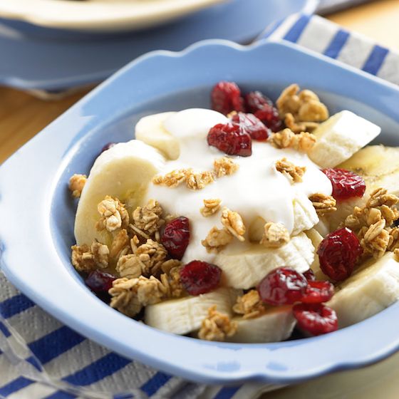 Image of Craisins® Crunch Breakfast Bowl with bananas, low-fat yogurt, granola and dried cranberries. 