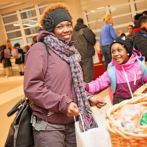 Mother and daughter receiving food at the Washington DC, Capital Area Food Bank 
